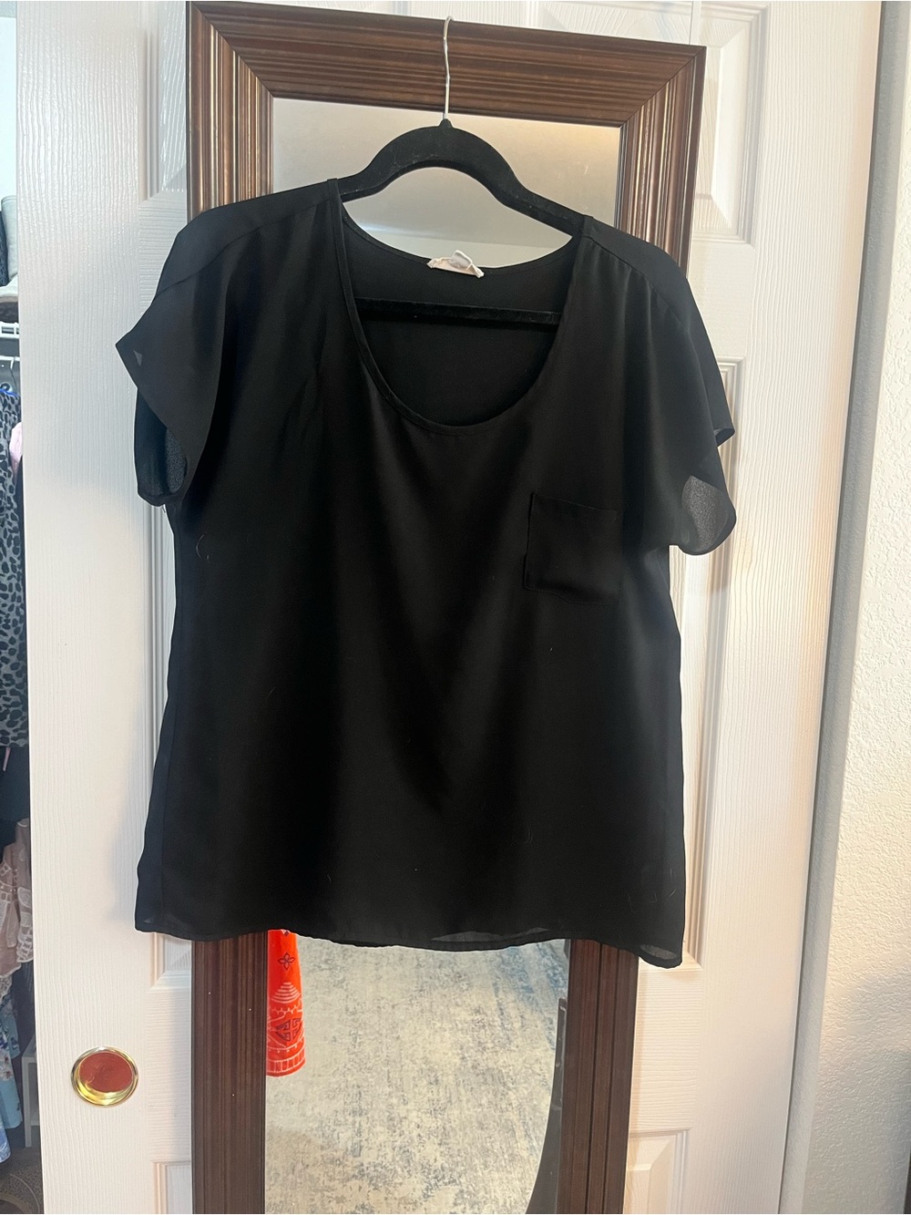 Black short sleeve top with pocket
